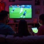 Streaming live soccer matches online on various platforms.