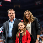 Aurora Rose Levesque posing with her family and celebrating her role in the WWE legacy.